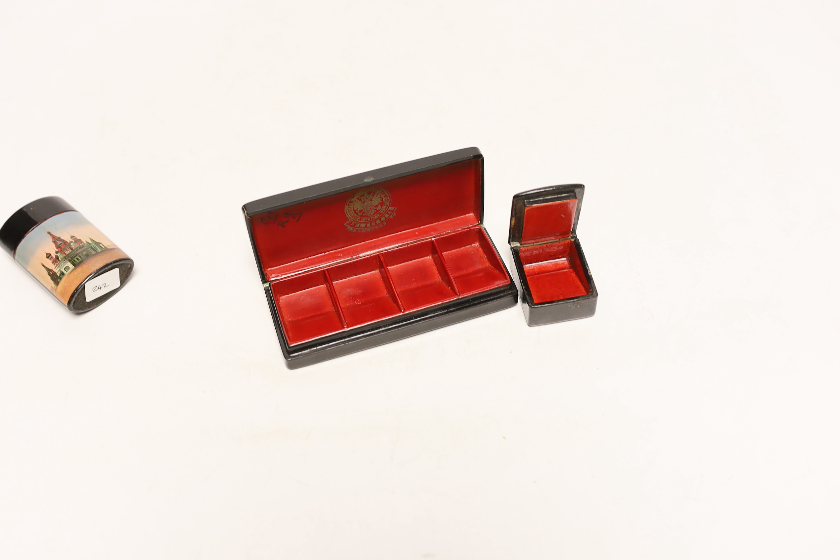 Two Russian lacquer ‘Kremlin’ stamp boxes and a similar vesta case, c.1900, largest 11cm, Please note this lot attracts an additional import tax of 5% on the hammer price